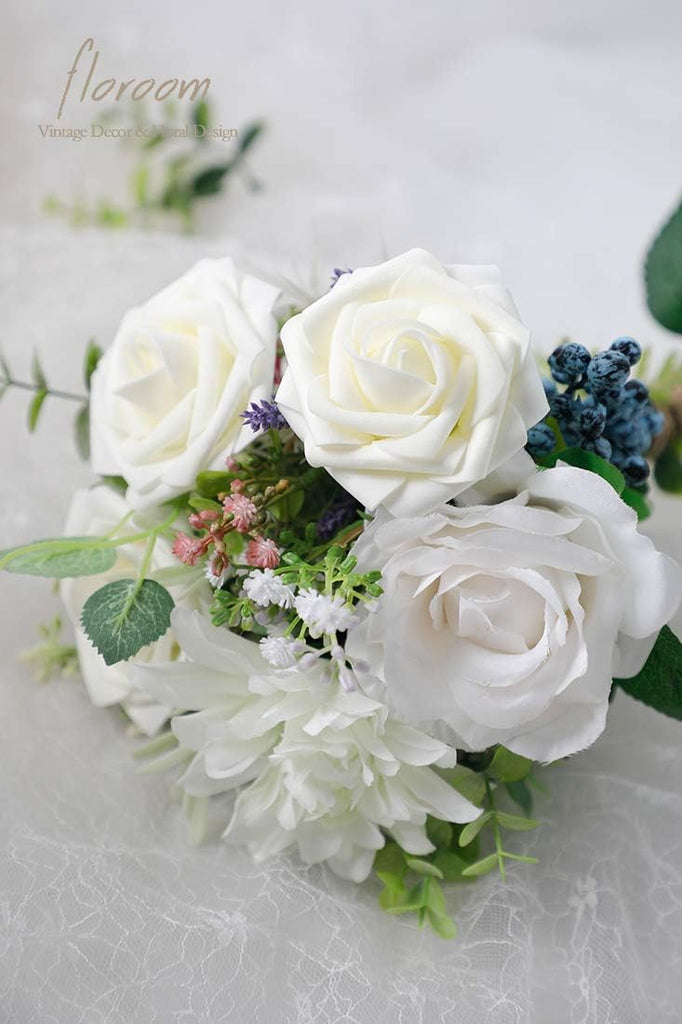 A 25-piece set of Floroom's ivory foam artificial roses with stems, perfect for creating elegant wedding bouquets or table decorations.